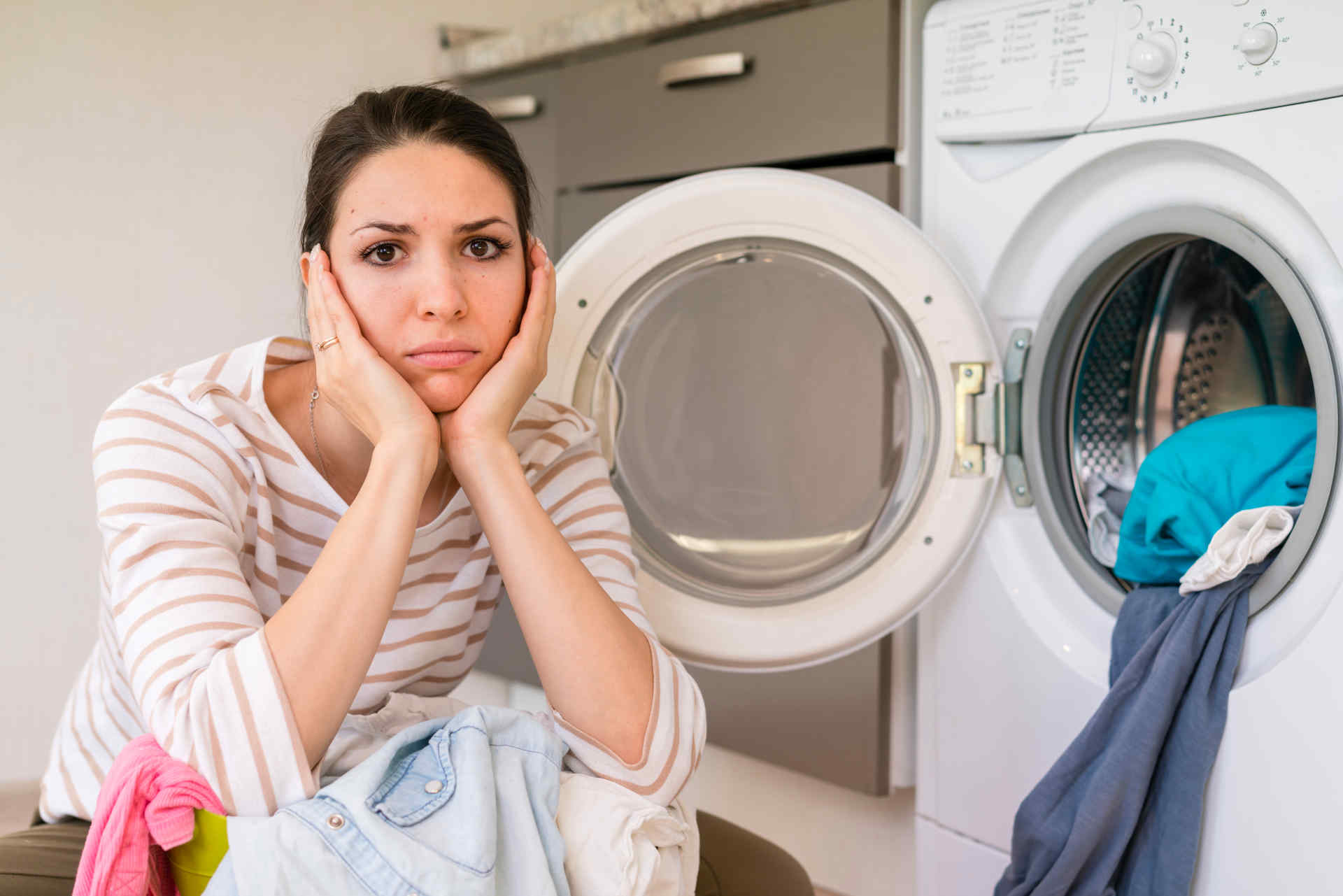 upset-woman-doing-laundry-portrait
